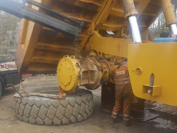 reinstalling a Cat 777F off highway truck rear final drive and brake assembly